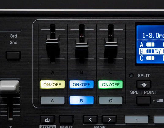 Close-up of a digital piano's control panel with buttons and sliders for sound modulation and function toggling.