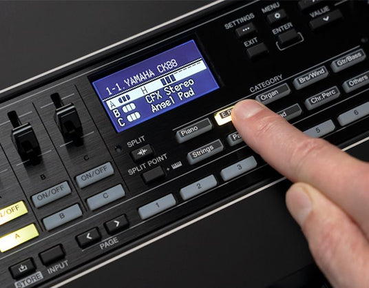 Person selecting a sound on a Yamaha digital piano or keyboard screen, featuring options like 'CFX Stereo' and 'Angel Pad'.
