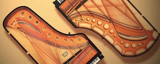 Two grand pianos with transparent tops revealing the intricate internal string and hammer mechanisms against a beige background.