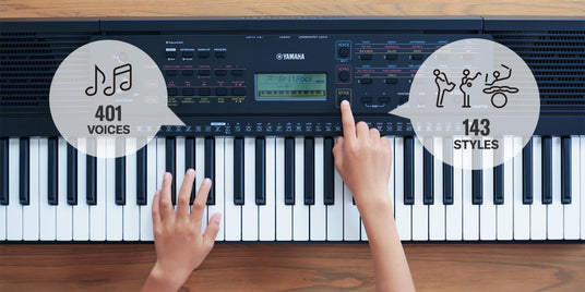 Person playing a Yamaha electronic keyboard with one hand and selecting options on the control panel, indicating 401 voices and 143 styles available.